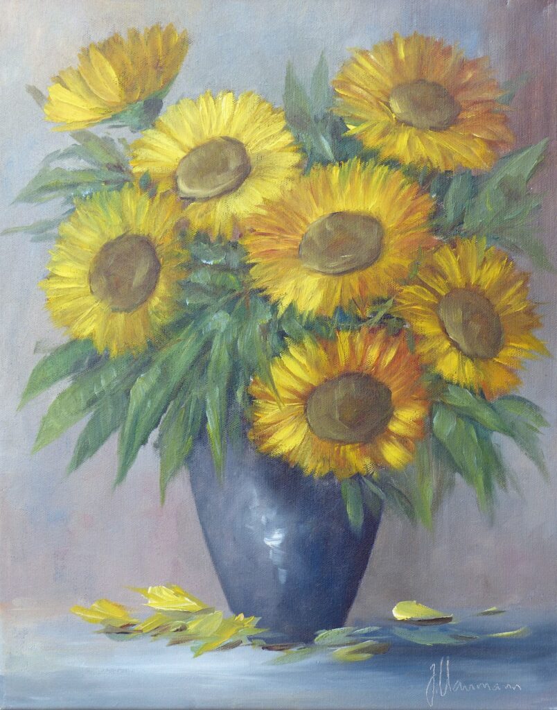 blaue Vase mit Sonnenblumen